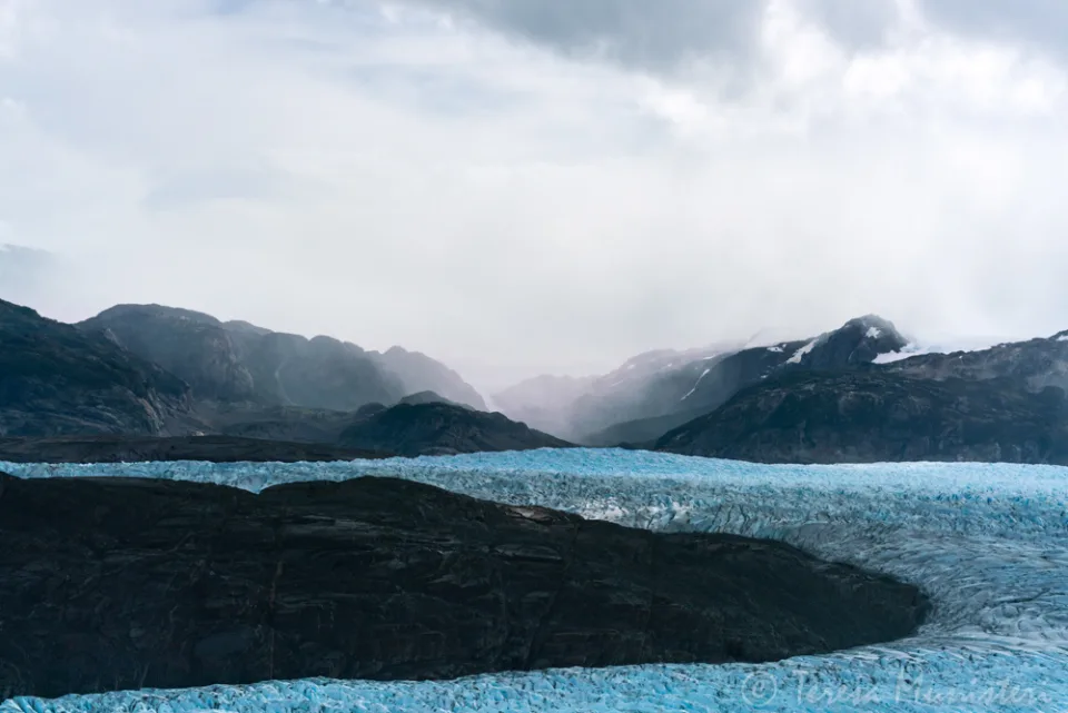 A glacier meeting the lake under low cloud, Torres del Paine