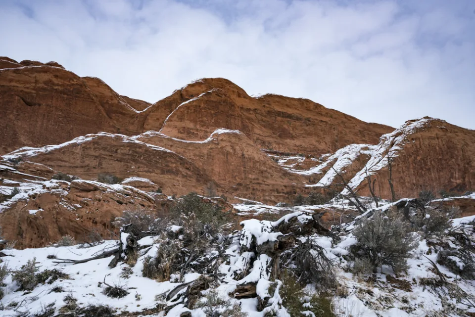 Snow dusting red rock ridges