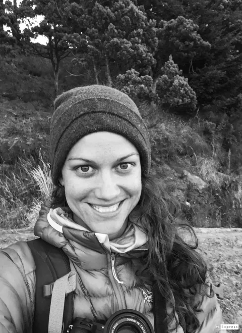Teresa Munisteri in the field with her camera